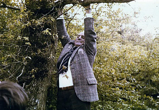 Don hanging from the very same tree in 1977, that he landed in back in April 1944